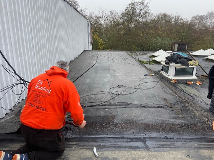 Commercial flat roof repair near me
